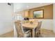 Charming dining area with light wood table and chairs at 13834 N 103Rd Ave, Sun City, AZ 85351