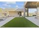 Artificial turf, stone patio, and desert landscaping at 14425 S Canyon Dr, Phoenix, AZ 85048