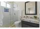 Modern bathroom with a glass shower and granite countertop at 14425 S Canyon Dr, Phoenix, AZ 85048