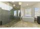 Modern bathroom with a large walk-in shower and soaking tub at 14425 S Canyon Dr, Phoenix, AZ 85048