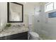 Modern bathroom with white tile, glass shower, and granite vanity at 14425 S Canyon Dr, Phoenix, AZ 85048