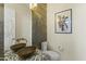 Modern bathroom with double sinks and artistic decor at 14425 S Canyon Dr, Phoenix, AZ 85048