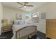 Bright bedroom with wood flooring and mountain views at 14425 S Canyon Dr, Phoenix, AZ 85048