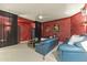 Home theater with comfortable seating and red walls at 14425 S Canyon Dr, Phoenix, AZ 85048