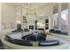 Spacious living room with circular seating and fireplace at 14425 S Canyon Dr, Phoenix, AZ 85048