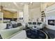 Open living area with curved sofas and a fireplace at 14425 S Canyon Dr, Phoenix, AZ 85048