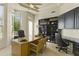 Bright home office with built in shelving and large window at 14425 S Canyon Dr, Phoenix, AZ 85048