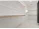 Spacious walk-in closet with ample shelving and hanging rods at 14525 W Andrea Dr, Surprise, AZ 85387