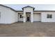 Modern home with covered entryway and neutral exterior at 14525 W Andrea Dr, Surprise, AZ 85387