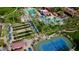 Aerial view of community amenities including pools and tennis courts at 15113 W Cactus Ridge Way, Surprise, AZ 85374
