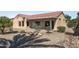 Landscaped backyard with gravel and desert plants at 15113 W Cactus Ridge Way, Surprise, AZ 85374