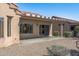 Backyard view showcasing the home's exterior and landscaping at 15113 W Cactus Ridge Way, Surprise, AZ 85374