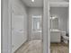 Simple bathroom with white vanity and bathtub at 15113 W Cactus Ridge Way, Surprise, AZ 85374