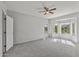 Bright bedroom with bay window and ceiling fan at 15113 W Cactus Ridge Way, Surprise, AZ 85374