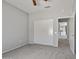 Bedroom with ceiling fan and sliding door closet at 15113 W Cactus Ridge Way, Surprise, AZ 85374