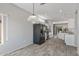 Casual dining area with wood-look floors and a view of the kitchen at 15113 W Cactus Ridge Way, Surprise, AZ 85374