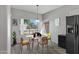 Bright dining area with table and chairs near kitchen at 15113 W Cactus Ridge Way, Surprise, AZ 85374