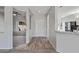 Bright entryway with tile flooring, neutral walls, and views into the living room and kitchen at 15113 W Cactus Ridge Way, Surprise, AZ 85374
