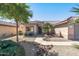 Front entry of single-story house with walkway and landscaping at 15113 W Cactus Ridge Way, Surprise, AZ 85374