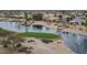 Aerial view of a peaceful golf course with a lake at 15113 W Cactus Ridge Way, Surprise, AZ 85374