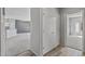 Bright hallway with tile flooring and closet at 15113 W Cactus Ridge Way, Surprise, AZ 85374