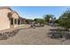 Landscaped backyard with gravel, rocks, and desert plants at 15113 W Cactus Ridge Way, Surprise, AZ 85374