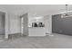 Open concept living room with kitchen and entryway at 15113 W Cactus Ridge Way, Surprise, AZ 85374