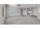 Spacious living room featuring neutral walls and carpet flooring at 15113 W Cactus Ridge Way, Surprise, AZ 85374