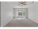 Main bedroom with bay window and ceiling fan at 15113 W Cactus Ridge Way, Surprise, AZ 85374