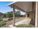 Covered patio with desert landscaping and a view of the backyard at 15113 W Cactus Ridge Way, Surprise, AZ 85374