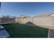 Artificial turf backyard with trampoline and play area at 15282 W Mckinley St, Goodyear, AZ 85338