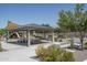 Community gazebo with shaded seating and nearby playground at 15282 W Mckinley St, Goodyear, AZ 85338