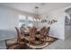 Formal dining room with wood table and chairs at 15282 W Mckinley St, Goodyear, AZ 85338