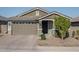 Two-car garage, front porch and landscaping at 15282 W Mckinley St, Goodyear, AZ 85338