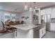 Kitchen island with granite countertop and stainless steel dishwasher at 15282 W Mckinley St, Goodyear, AZ 85338
