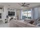 Living room featuring a sectional sofa and fireplace at 15282 W Mckinley St, Goodyear, AZ 85338