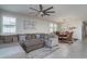 Open living space with sectional sofa and dining area at 15282 W Mckinley St, Goodyear, AZ 85338