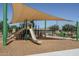 Community playground with shade structure and play equipment at 15282 W Mckinley St, Goodyear, AZ 85338