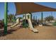 Community playground with slides and shade structure at 15282 W Mckinley St, Goodyear, AZ 85338