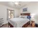 Comfortable guest bedroom with a floral bedspread and ceiling fan at 15708 E Chicory Dr, Fountain Hills, AZ 85268