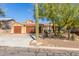 Front view of the house with a three car garage at 15708 E Chicory Dr, Fountain Hills, AZ 85268