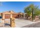 House exterior with three-car garage and desert landscaping at 15708 E Chicory Dr, Fountain Hills, AZ 85268