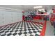 Garage with checkered floor, storage cabinets, and space for motorcycles and bicycles at 15708 E Chicory Dr, Fountain Hills, AZ 85268