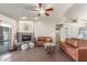 Spacious living room with fireplace, comfortable seating, and lots of natural light at 15708 E Chicory Dr, Fountain Hills, AZ 85268