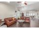 Spacious living room with leather sofas and tile flooring at 15708 E Chicory Dr, Fountain Hills, AZ 85268