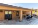 Outdoor patio with seating and access to the backyard and pool at 15708 E Chicory Dr, Fountain Hills, AZ 85268