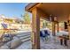 Covered patio with seating, providing shade and views of the pool at 15708 E Chicory Dr, Fountain Hills, AZ 85268