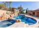 Inviting pool and spa surrounded by rocks and a private casita at 15708 E Chicory Dr, Fountain Hills, AZ 85268