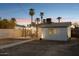 Charming backyard patio with string lights and palm trees at 1614 W Lynwood St, Phoenix, AZ 85007