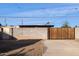 Backyard with a wooden gate and block wall at 1614 W Lynwood St, Phoenix, AZ 85007
